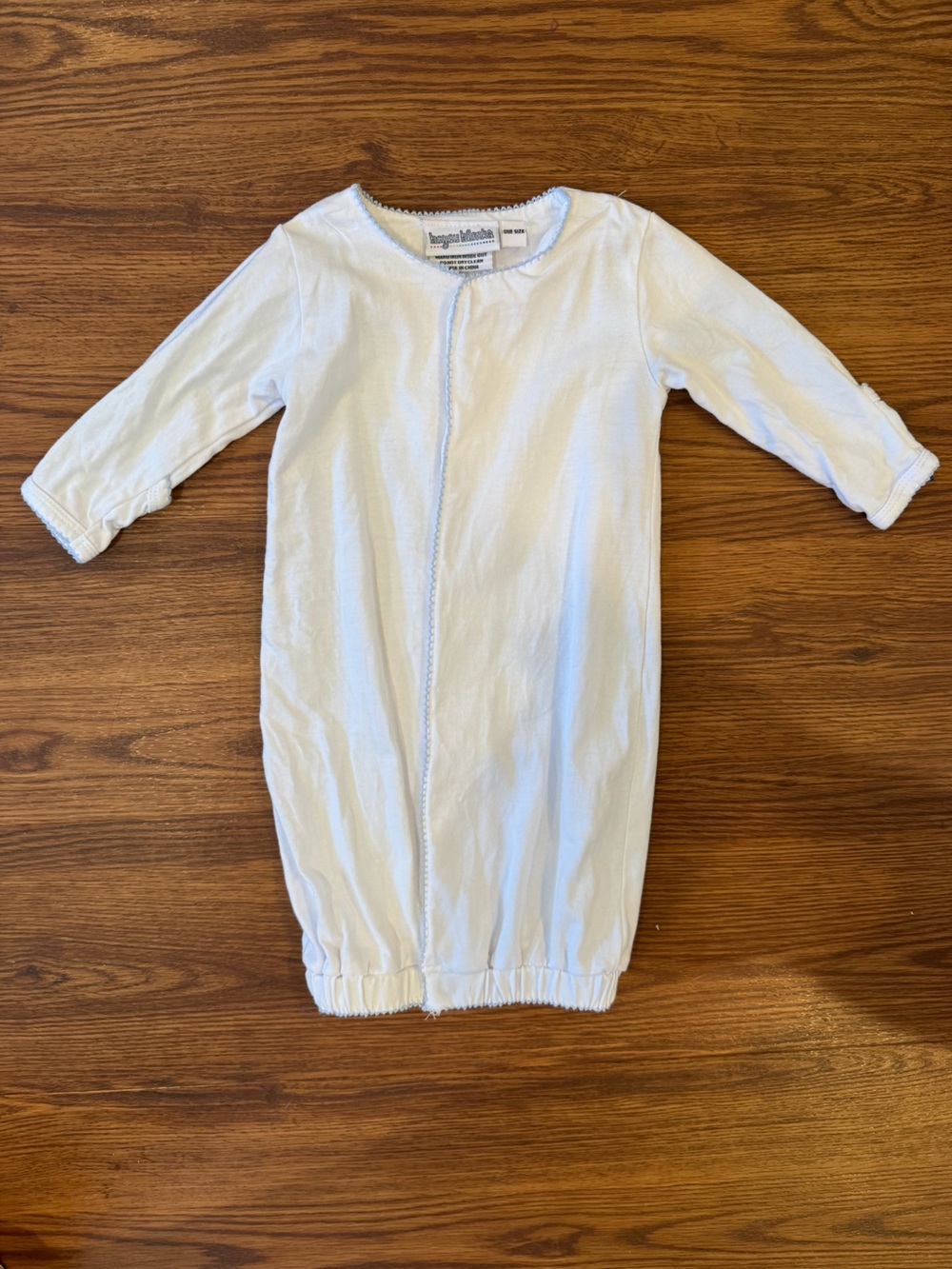 White baby gown with blue picot trim